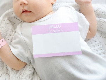 Baby wearing hello my name is sticker
