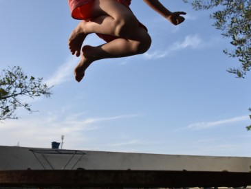 Young girl jumping on a trampoline