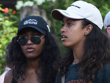 Sasha (L) and Malia (R), daughters of former US president Barack Obama, visit Tirtha Empul temple at Tampaksiring Village in Gianyar on the Indonesian resort island of Bali on June 27, 2017. Barack Obama kicked off a 10-day family holiday in Indonesia that will take in Bali and Jakarta, the city where he spent part of his childhood, officials said on June 24.
