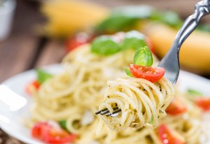 Spaghetti with basil Pesto on a fork (detailed close-up shot)