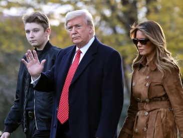 WASHINGTON, DC - NOVEMBER 26: U.S. President Donald Trump, first lady Melania Trump and their son Barron Trump walk across the South Lawn before leaving the White House on board Marine One November 26, 2019 in Washington, DC. Trump is traveling to Florida for a campaign rally and is scheduled to spend the Thanksgiving holiday at his private Mar-a-Lago Club.