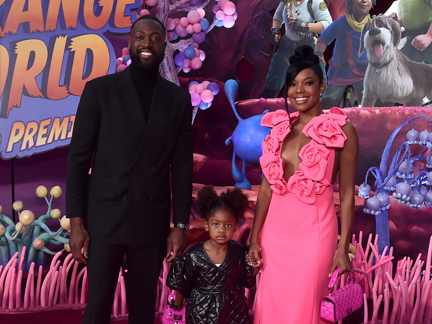 LOS ANGELES, CALIFORNIA - NOVEMBER 15: (L-R) Dwyane Wade, Kaavia James Union Wade, and Gabrielle Union attend the world premiere of Walt Disney Animation Studios' Strange World at El Capitan Theatre in Hollywood, California on November 15, 2022.