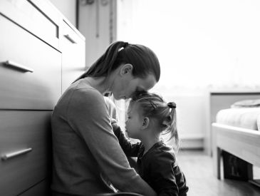 Mom comforting daughter